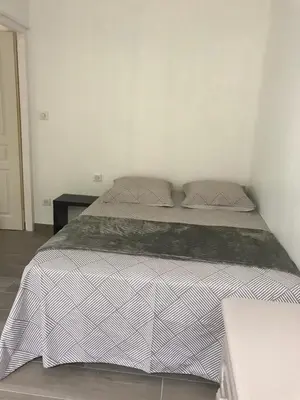 Un ou plusieurs lits dans un hébergement de l'établissement Maison Arcachon avec jardin