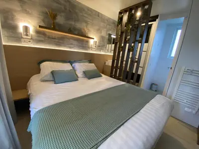 Un ou plusieurs lits dans un hébergement de l'établissement Mobil Home camping La Civelle