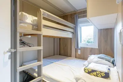 Un ou plusieurs lits dans un hébergement de l'établissement Chalet 809 tout confort en lisière de forêt