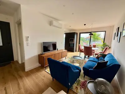 Télévision ou salle de divertissement dans l'établissement Charmant duplex parking proche Arcachon