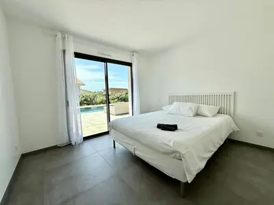 Un ou plusieurs lits dans un hébergement de l'établissement Villa Aurora Piscine 7 personnes