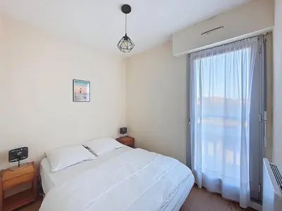 Un ou plusieurs lits dans un hébergement de l'établissement Appartement T2 avec piscine, parking - Vieux-Boucau - FR-1-857-41