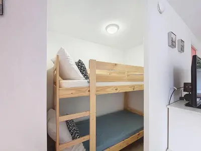 Un ou plusieurs lits dans un hébergement de l'établissement Soustons Plage : T2 Cabine 4 pers avec Box Privatif - FR-1-857-35