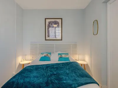 Un ou plusieurs lits dans un hébergement de l'établissement Apartment Les Hauts de la Corniche by Interhome