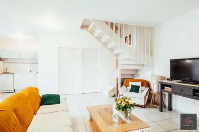 Télévision ou salle de divertissement dans l'établissement Biscarrosse centre Duplex avec terrasse 6 personnes