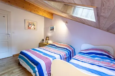 Un ou plusieurs lits dans un hébergement de l'établissement Maison 3 chambres près du Lac de Navarrosse – Jardin terrasse