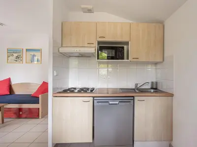 Cuisine ou kitchenette dans l'établissement Allee des Dunes N31 -3P6