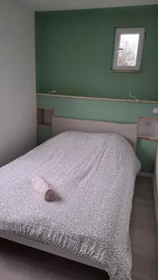 Un ou plusieurs lits dans un hébergement de l'établissement Bel appartement à Dax