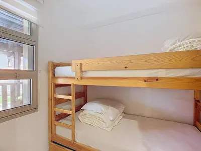 Un ou plusieurs lits dans un hébergement de l'établissement Appartement 5 pers avec piscine et parking à Vieux-Boucau - FR-1-857-61