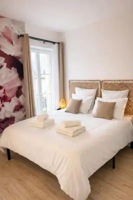 Un ou plusieurs lits dans un hébergement de l'établissement La Villa Blanche Appart hôtel