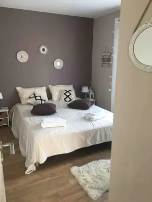 Un ou plusieurs lits dans un hébergement de l'établissement Maison côté lac