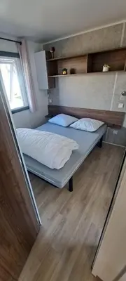 Un ou plusieurs lits dans un hébergement de l'établissement Mobil home camping les Oyats
