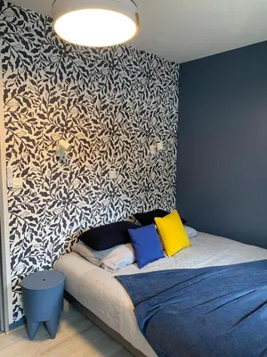 Un ou plusieurs lits dans un hébergement de l'établissement La Suite Unique - Cottage cosy - 2 chambres - vue Golf - 10 mn des Thermes - Linge inclus-