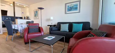 Coin salon dans l'établissement Appartement Laurens Vue Port et Océan 4 pers