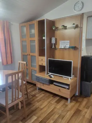 Télévision ou salle de divertissement dans l'établissement Mobilhome