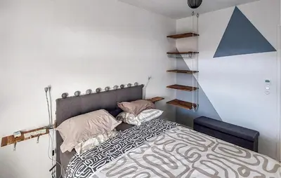 Un ou plusieurs lits dans un hébergement de l'établissement Bel Appartement Avec Terrasse