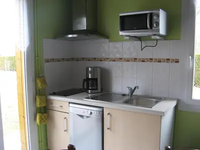 Cuisine ou kitchenette dans l'établissement La Petite Mongesse