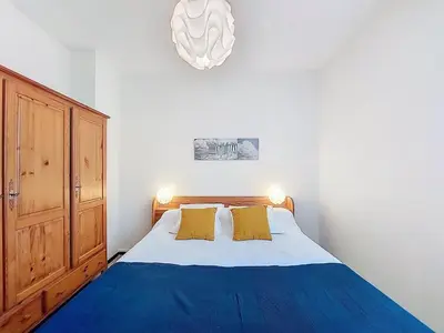 Un ou plusieurs lits dans un hébergement de l'établissement Apartment La Centrale-10 by Interhome