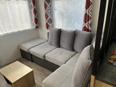 Coin salon dans l'établissement MH 470 3chambres et 1salle de bain dans camping 4 étoiles