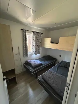 Un ou plusieurs lits dans un hébergement de l'établissement Camping les Olyats