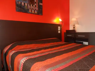 Un ou plusieurs lits dans un hébergement de l'établissement hotel la siesta