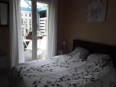 Un ou plusieurs lits dans un hébergement de l'établissement Tiny House et chambre chez l habitant