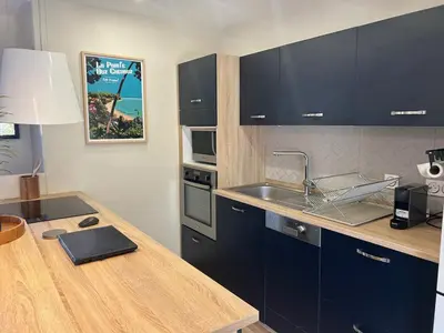 Cuisine ou kitchenette dans l'établissement maison la teste