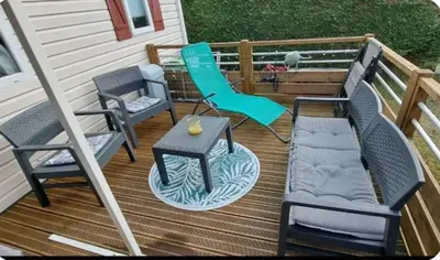 Coin salon dans l'établissement Mobil home