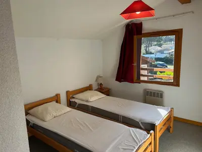 Un ou plusieurs lits dans un hébergement de l'établissement maison village khelus