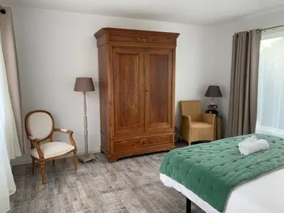 Un ou plusieurs lits dans un hébergement de l'établissement Villa d'Exception 7 chambres au coeur du golf de Biscarrosse