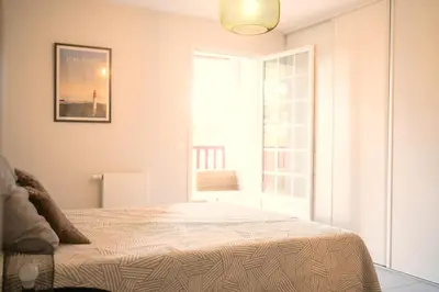 Un ou plusieurs lits dans un hébergement de l'établissement Grand appartement-lac-centre-hossegor