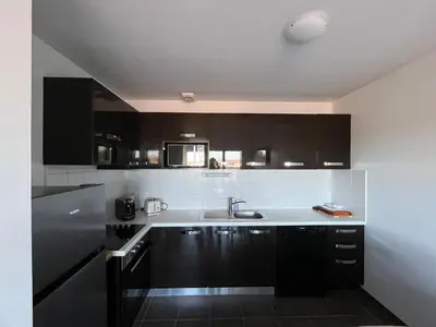 Cuisine ou kitchenette dans l'établissement Appartement cosy centre-ville, animaux admis - 6 pers. - FR-1-319-629