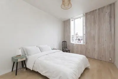 Un ou plusieurs lits dans un hébergement de l'établissement Appartement de caractère au cœur du centre ville avec très belle terrasse