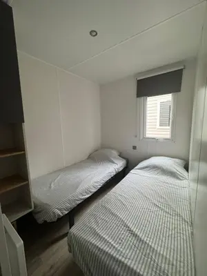 Un ou plusieurs lits dans un hébergement de l'établissement Mobilhome 3ch 2sdb climatisé