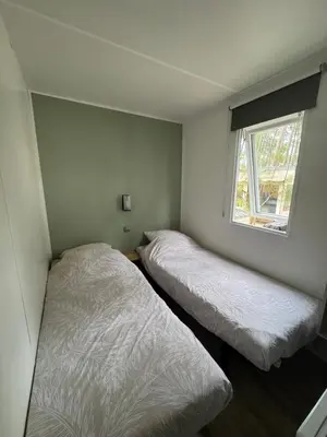 Un ou plusieurs lits dans un hébergement de l'établissement Mobilhome 3ch 2sdb climatisé