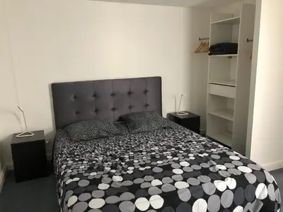 Un ou plusieurs lits dans un hébergement de l'établissement Les Locations du Bassin Appartements Alexandre