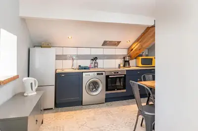 Cuisine ou kitchenette dans l'établissement Les Ecuries du SEQUE