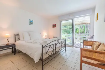 Un ou plusieurs lits dans un hébergement de l'établissement Madame Vacances Villas Club Royal Ocean 17