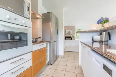 Cuisine ou kitchenette dans l'établissement Madame Vacances Villas Club Royal Ocean 17