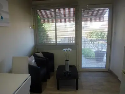 Coin salon dans l'établissement Appartement proche Centre et Arènes