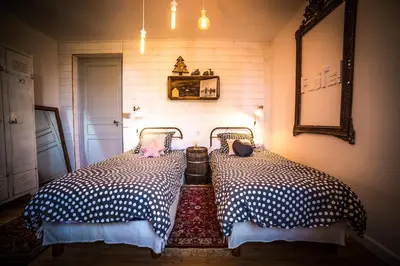 Un ou plusieurs lits dans un hébergement de l'établissement Les chambres de Lily