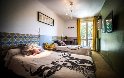 Un ou plusieurs lits dans un hébergement de l'établissement Les chambres de Lily