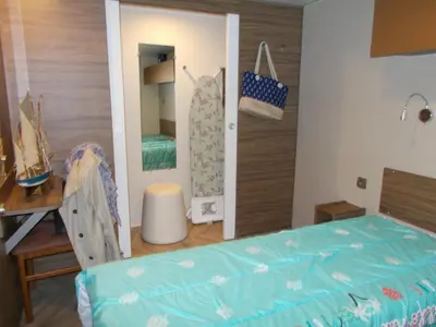 Un ou plusieurs lits dans un hébergement de l'établissement mobilhome charme funpass et wifi inclus