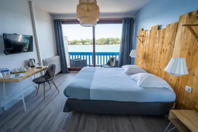 Un ou plusieurs lits dans un hébergement de l'établissement Le Relais Du Lac