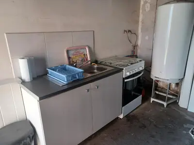 Cuisine ou kitchenette dans l'établissement La Forge