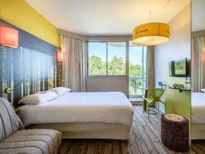 Un ou plusieurs lits dans un hébergement de l'établissement ibis styles Dax Centre