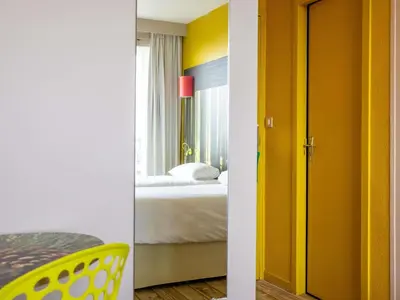 Un ou plusieurs lits dans un hébergement de l'établissement ibis styles Dax Centre