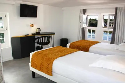 Un ou plusieurs lits dans un hébergement de l'établissement Hôtel du Parc & Spa