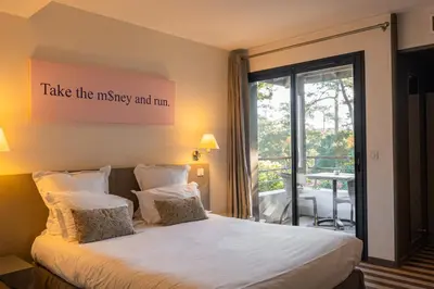Un ou plusieurs lits dans un hébergement de l'établissement Hotel 202