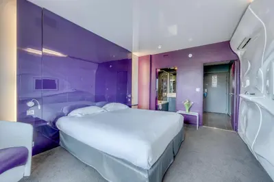 Un ou plusieurs lits dans un hébergement de l'établissement Comfort Aparthotel Bassin d'Arcachon